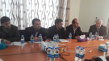 Emeritus Professor Ted Parnall (right) talks with faculty from private universities in Kabul, Afghanistan