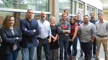 Professors John Whitlow and Serge Martinez (second and third from left) with students in the Fall 2017 Economic Justice Clinic.